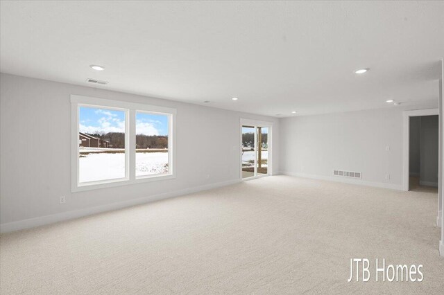 interior space with baseboards, recessed lighting, and visible vents