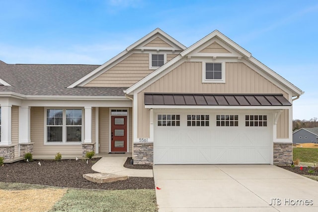 craftsman inspired home with board and batten siding, a standing seam roof, and stone siding