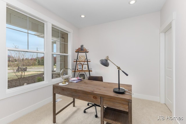 office space with light colored carpet, recessed lighting, baseboards, and a wealth of natural light