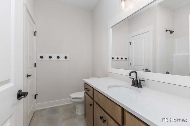 full bathroom featuring vanity, toilet, baseboards, and a shower