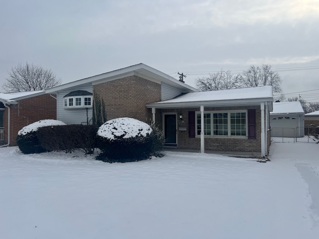 view of front of home with an outbuilding and a garage