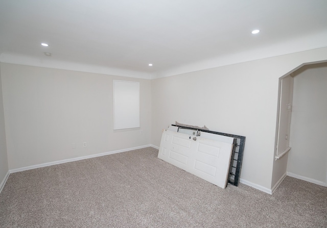 unfurnished living room featuring light carpet