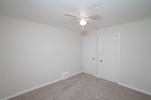 unfurnished bedroom with carpet floors and ceiling fan