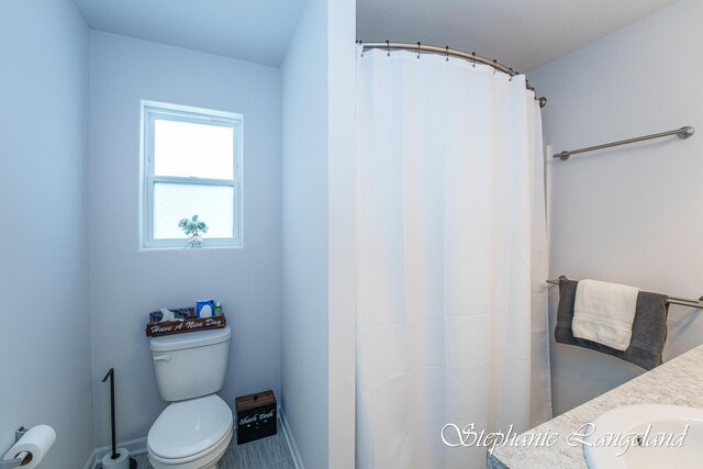 5337 Division Ave N, Comstock Park, MI 49321 - full bath with toilet, vanity, and curtained shower