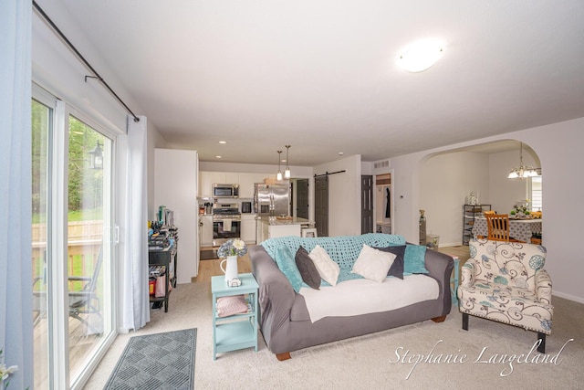5337 Division Ave N, Comstock Park, MI 49321 - living area with arched walkways and light carpet