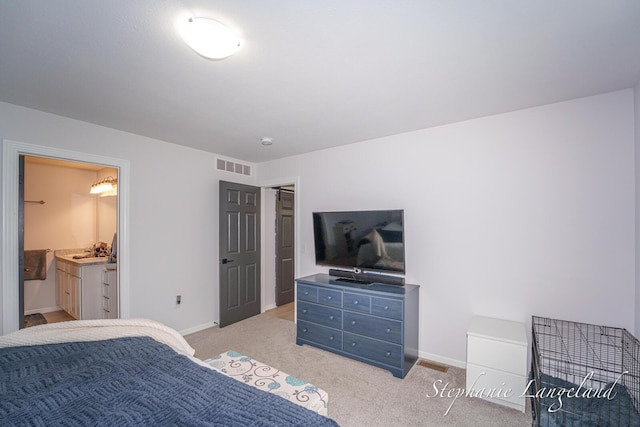 5337 Division Ave N, Comstock Park, MI 49321 - bedroom featuring light colored carpet, baseboards, and ensuite bathroom