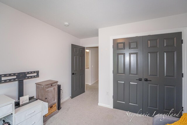 5337 Division Ave N, Comstock Park, MI 49321 - bedroom with light colored carpet, baseboards, and a closet
