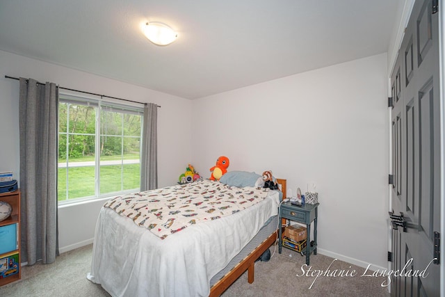 5337 Division Ave N, Comstock Park, MI 49321 - carpeted bedroom featuring baseboards