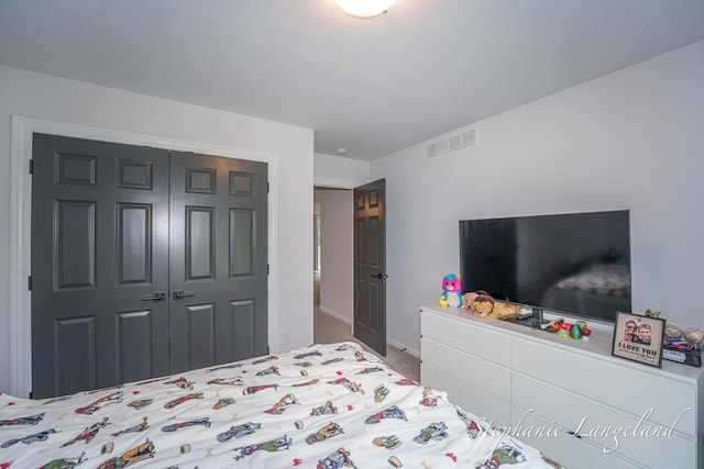 5337 Division Ave N, Comstock Park, MI 49321 - bedroom with baseboards, a closet, and carpet