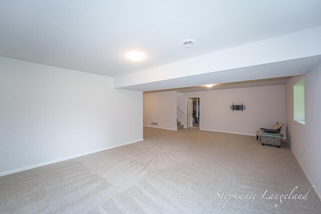 5337 Division Ave N, Comstock Park, MI 49321 - finished below grade area with carpet flooring, stairway, and baseboards