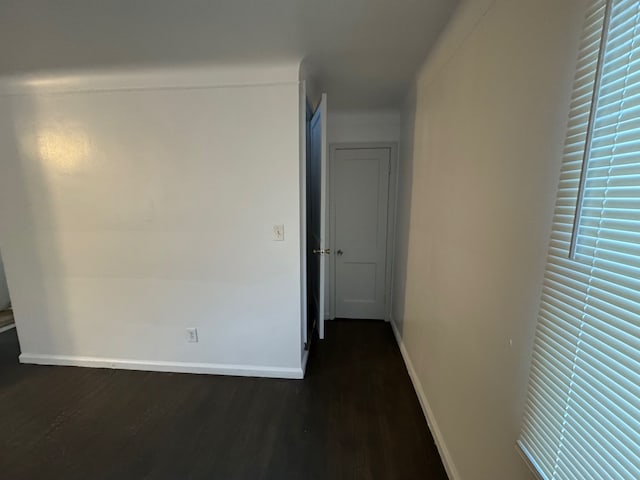 hallway featuring dark wood-type flooring