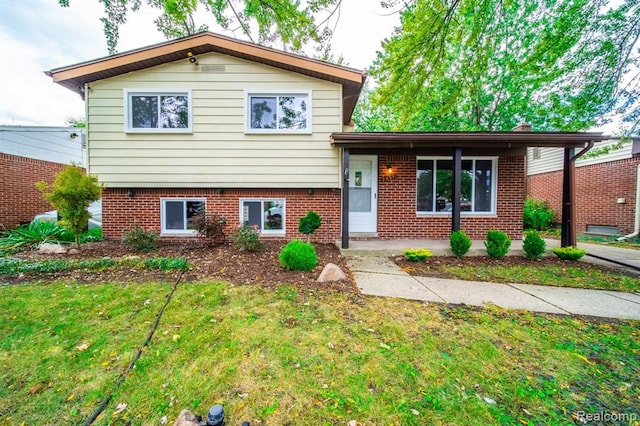 split level home with a front yard