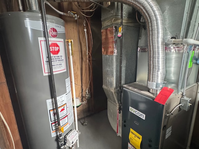 utility room featuring water heater