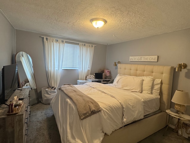 carpeted bedroom with a textured ceiling