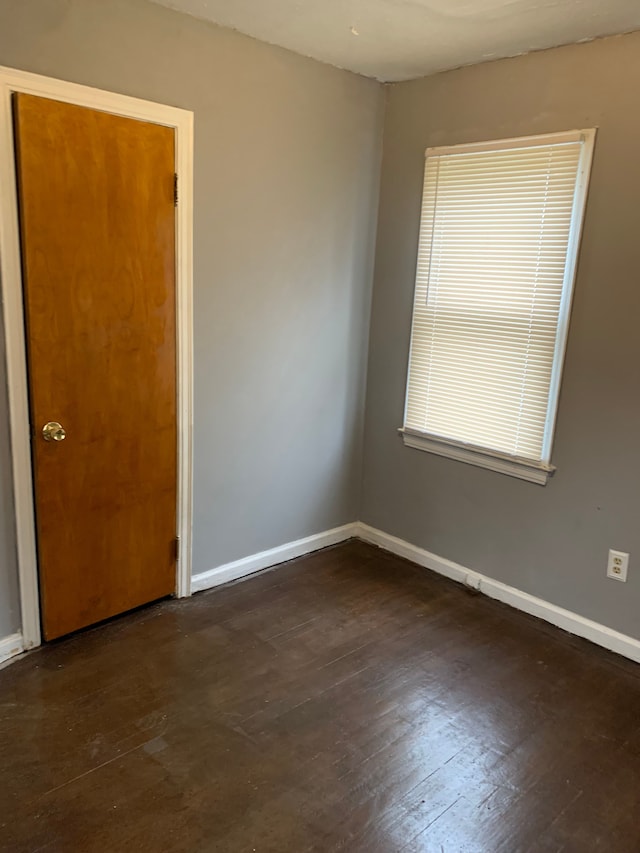 empty room featuring dark hardwood / wood-style floors