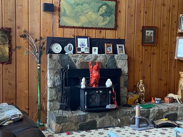 room details featuring a wood stove and wood walls