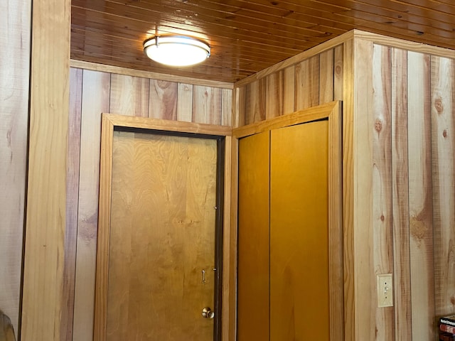 details featuring wood walls and wood ceiling