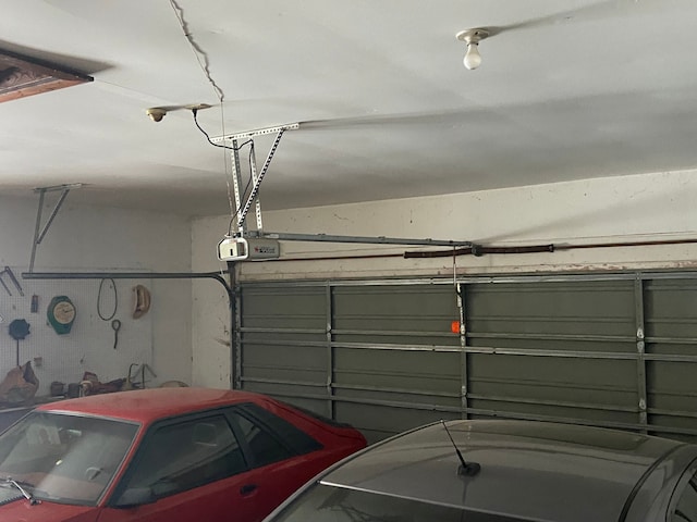 8899 Dwyer Rd, Howell, MI 48855 - garage featuring a garage door opener