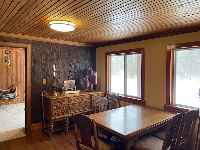 dining space with wooden ceiling, light wood-type flooring, and plenty of natural light