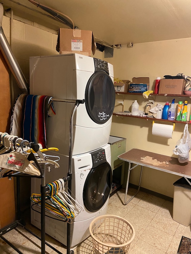 washroom featuring stacked washer and dryer