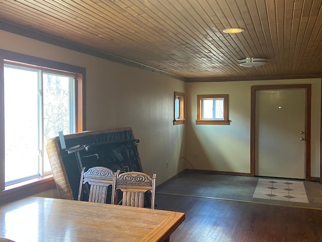 8899 Dwyer Rd, Howell, MI 48855 - dining room featuring baseboards, wood finished floors, and wooden ceiling