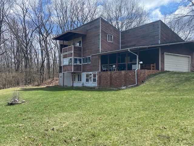 8899 Dwyer Rd, Howell, MI 48855 - view of side of home with a yard, an attached garage, and a balcony