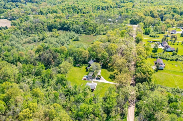 8899 Dwyer Rd, Howell, MI 48855 - drone / aerial view of a heavily wooded area