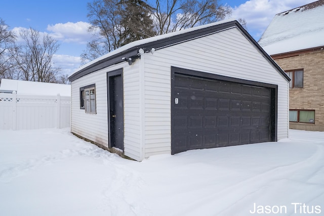 view of snow covered garage