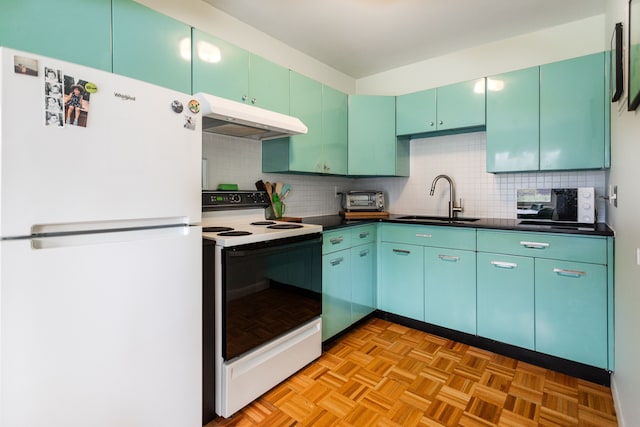 kitchen featuring decorative backsplash, sink, and white appliances