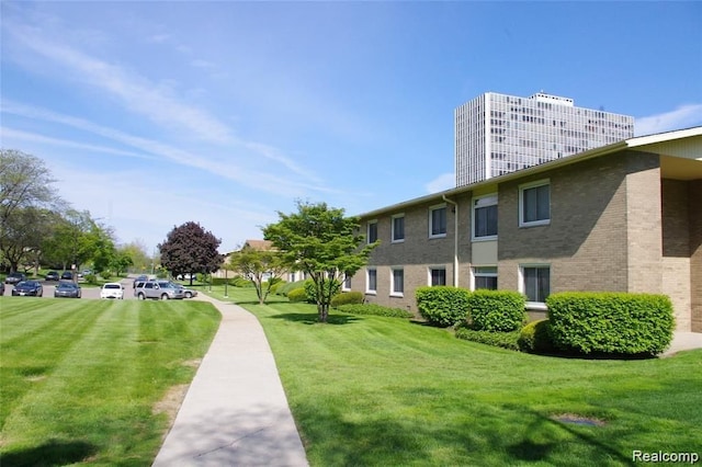 view of home's community with a lawn