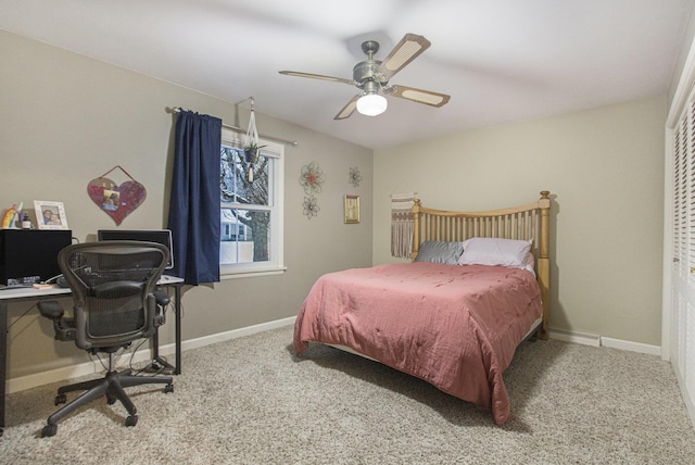 carpeted bedroom featuring ceiling fan and a closet