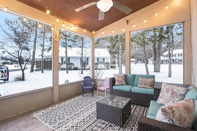 sunroom with ceiling fan, wooden ceiling, and lofted ceiling