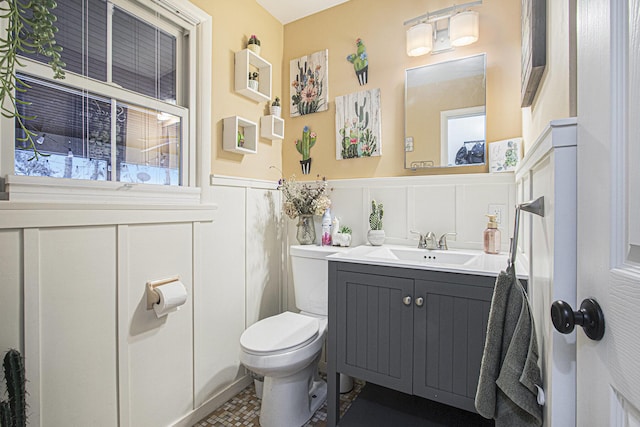 bathroom with tile patterned floors, vanity, and toilet