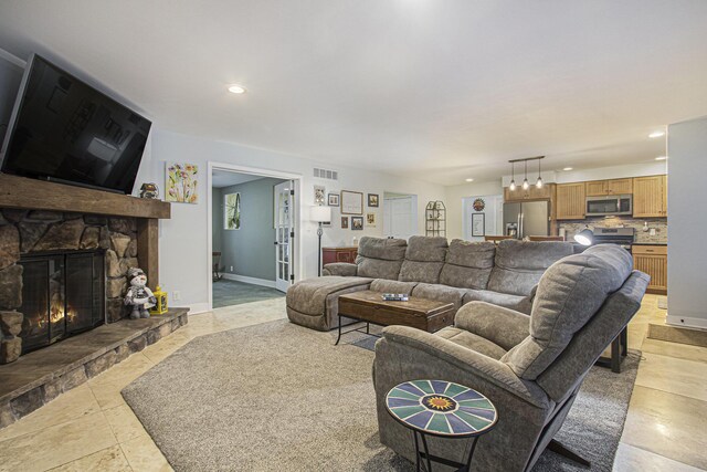 living room featuring a fireplace