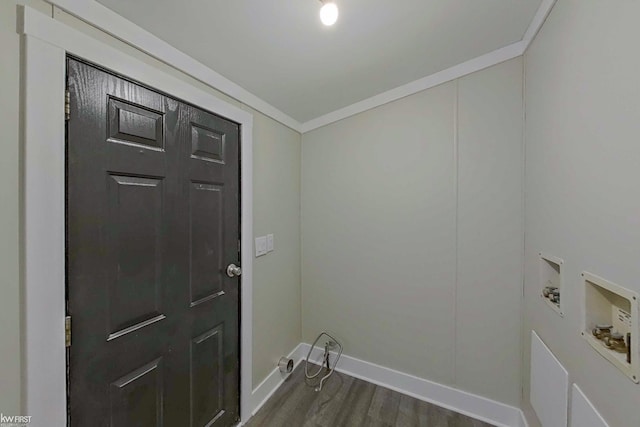 laundry room with dark wood-type flooring, washer hookup, and ornamental molding