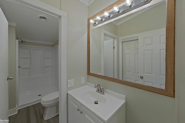 bathroom with vanity, lofted ceiling, hardwood / wood-style flooring, toilet, and walk in shower