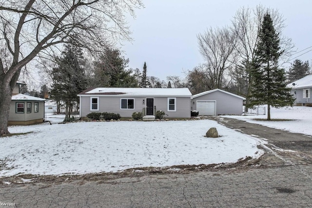 view of front facade featuring an outbuilding and a garage