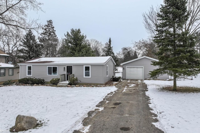 view of front of property featuring an outdoor structure and a garage