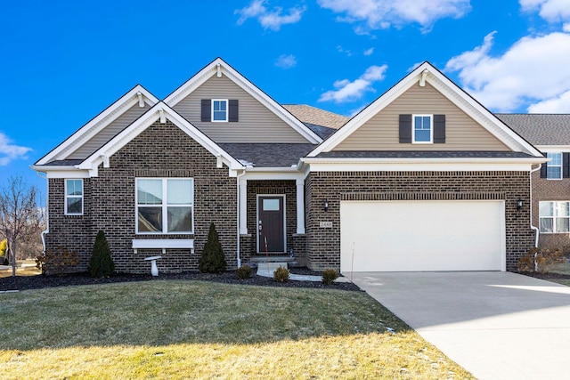 view of front of property with a front lawn and a garage