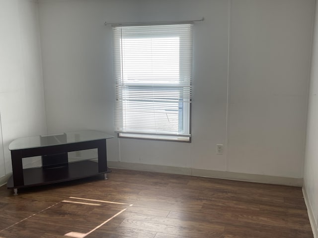 unfurnished room featuring dark hardwood / wood-style floors