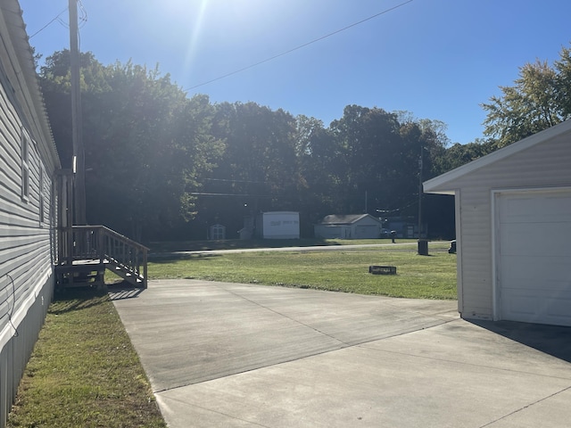 view of patio featuring an outdoor structure and a garage