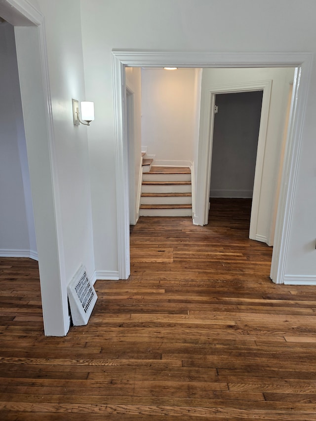 hallway featuring dark wood-type flooring