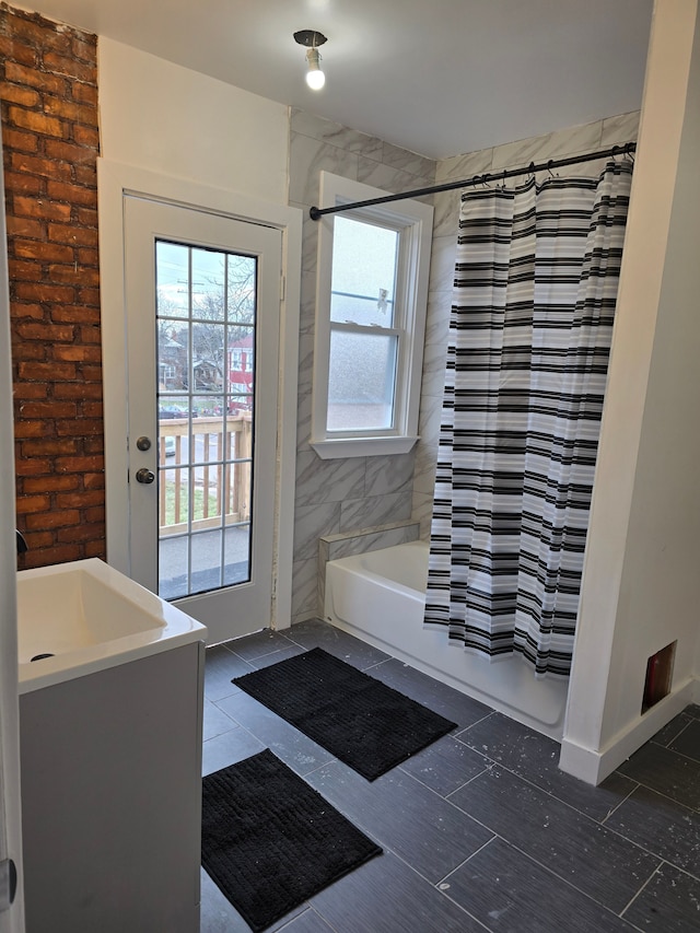 bathroom with shower / bath combo with shower curtain and vanity