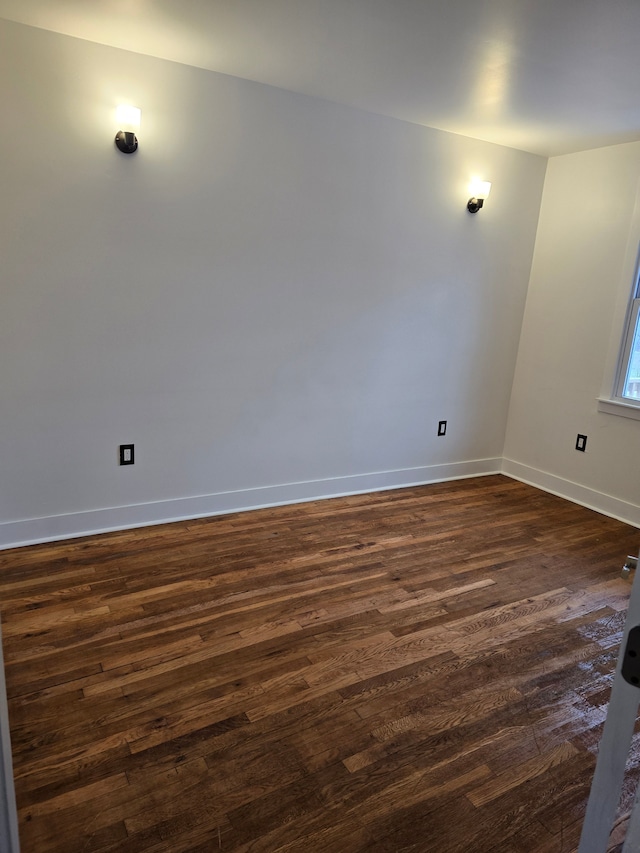 empty room featuring dark hardwood / wood-style floors