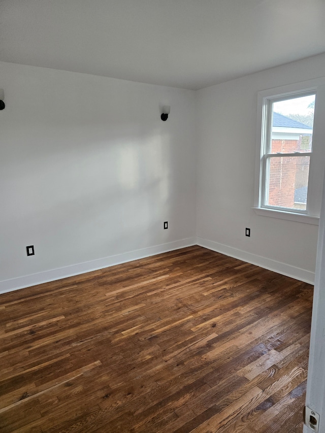 unfurnished room featuring dark hardwood / wood-style floors