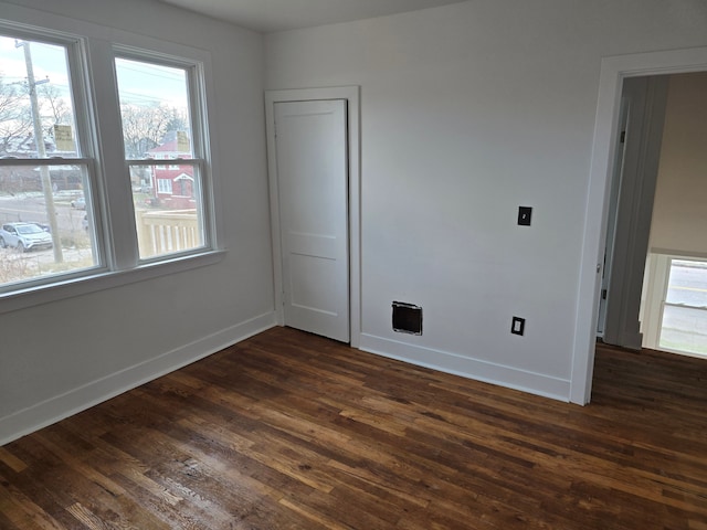 empty room featuring dark hardwood / wood-style floors