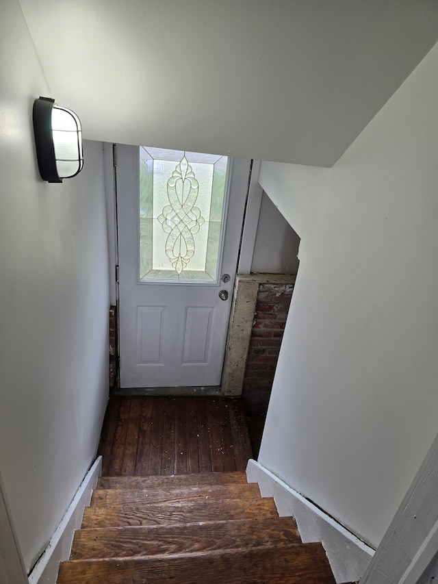 staircase featuring hardwood / wood-style flooring