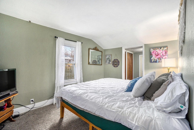 bedroom featuring lofted ceiling and carpet