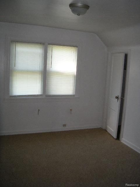 bonus room featuring lofted ceiling