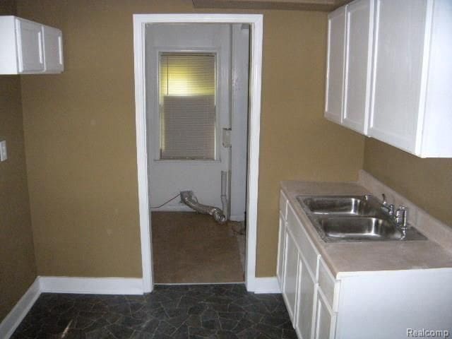 kitchen with white cabinets and sink